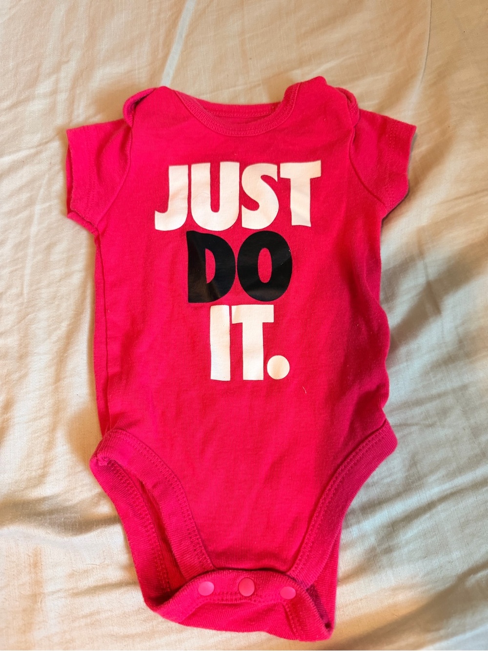 Nike bright pink just do it girls short sleeve crew neck baby bodysuit